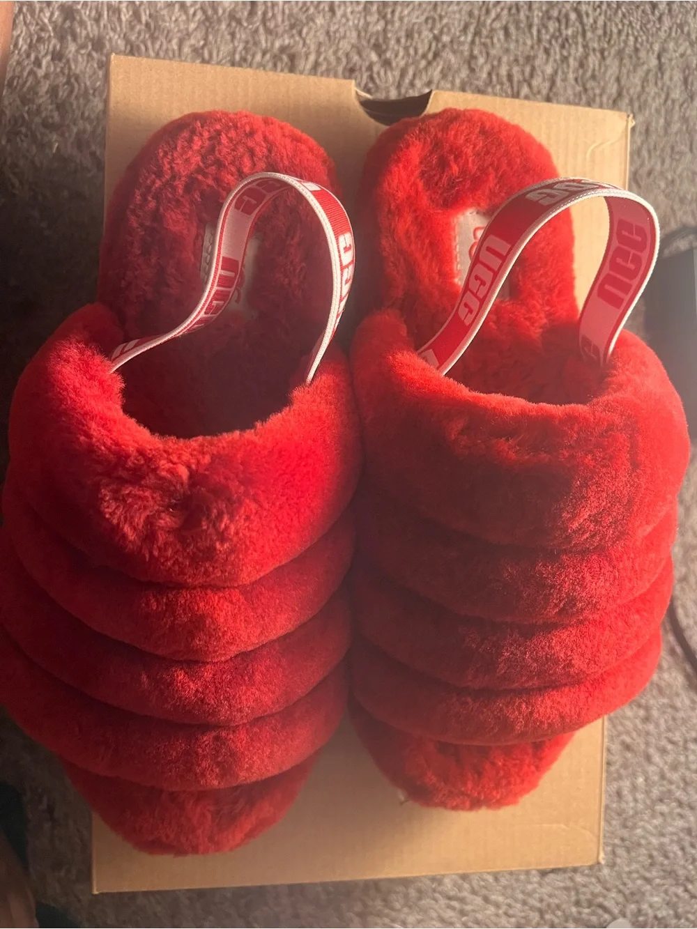 Red Kids Ugg Slides Never worn and good condition.